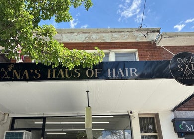 Sana's Haus of Hair entrance in Bexley North, New South Wales, AU with vibrant signage.