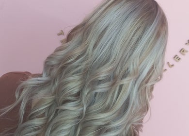 Elegant wavy silver hair styled at The Look Hair Gallery, Potchefstroom, North West, ZA.
