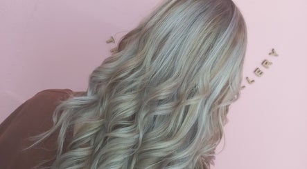 Elegant wavy silver hair styled at The Look Hair Gallery, Potchefstroom, North West, ZA.