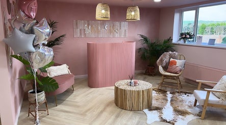 Elegant pink reception area at Nails by Gem, Newtownabbey, Northern Ireland, GB with stylish decor.