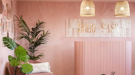 Stylish pink interior at Nails by Gem, Newtownabbey, Northern Ireland, GB with boho decor and plant accents.