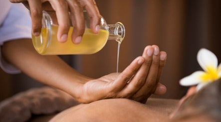 Massage oil being poured at Boonya Spa Thai Massage Covent Garden, London, England, GB for relaxation.
