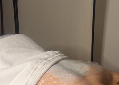 Client receiving treatment at AMS Sports Therapy, Wishaw, Scotland, GB, showcasing expert wellness care.