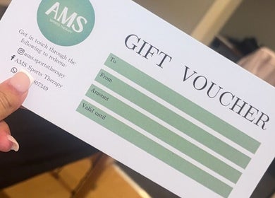 AMS Sports Therapy gift voucher in hand, Wishaw, Scotland, GB.