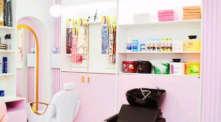 Bright salon interior at Nicky's Hub, Johannesburg, Gauteng, ZA featuring styling chairs and beauty products.
