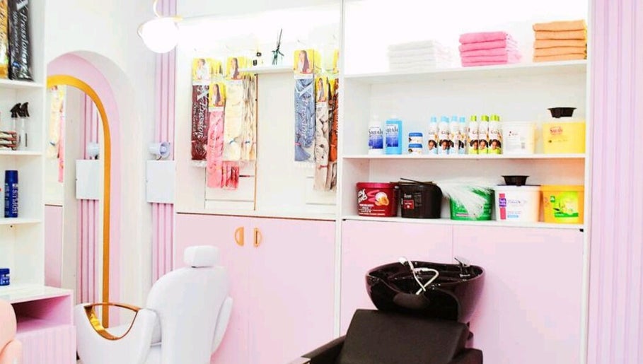 Chic salon interior at Nicky's hub, Johannesburg, Gauteng, ZA with pastel decor and beauty products.
