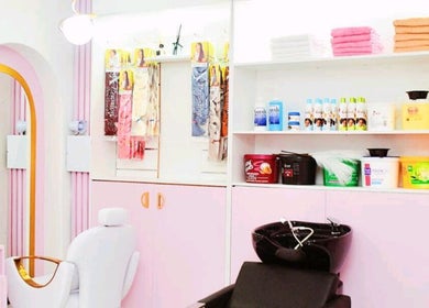 Chic salon interior at Nicky's hub, Johannesburg, Gauteng, ZA with pastel decor and beauty products.