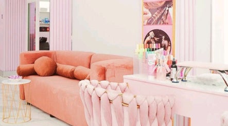 Elegantly decorated lounge at Nicky's hub in Johannesburg, Gauteng, ZA with plush seating and beauty products on display.