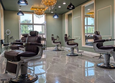 Luxurious salon area at BOUTIQUE SPA, Abu Dhabi, Abu Dhabi, AE with stylish chairs and chandeliers.