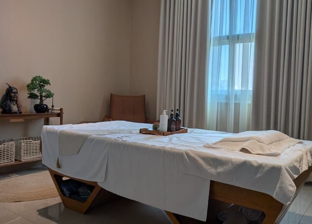 Massage table at Boutique Spa in Abu Dhabi with serene decor and natural light.