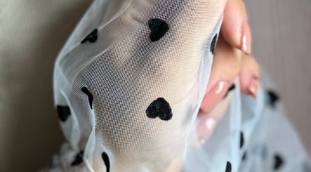 Delicate mesh with hearts held at She & He Studio, Llanybydder, Wales, GB. Elegant beauty representation.
