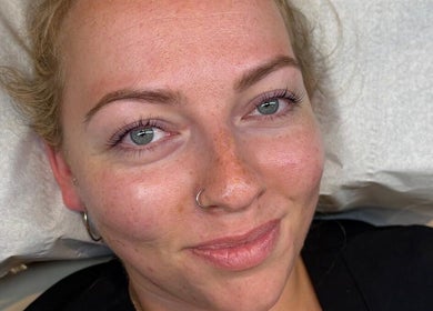 A relaxed client with radiant skin post-treatment at The Glow Room - Calne in Calne, England, GB.