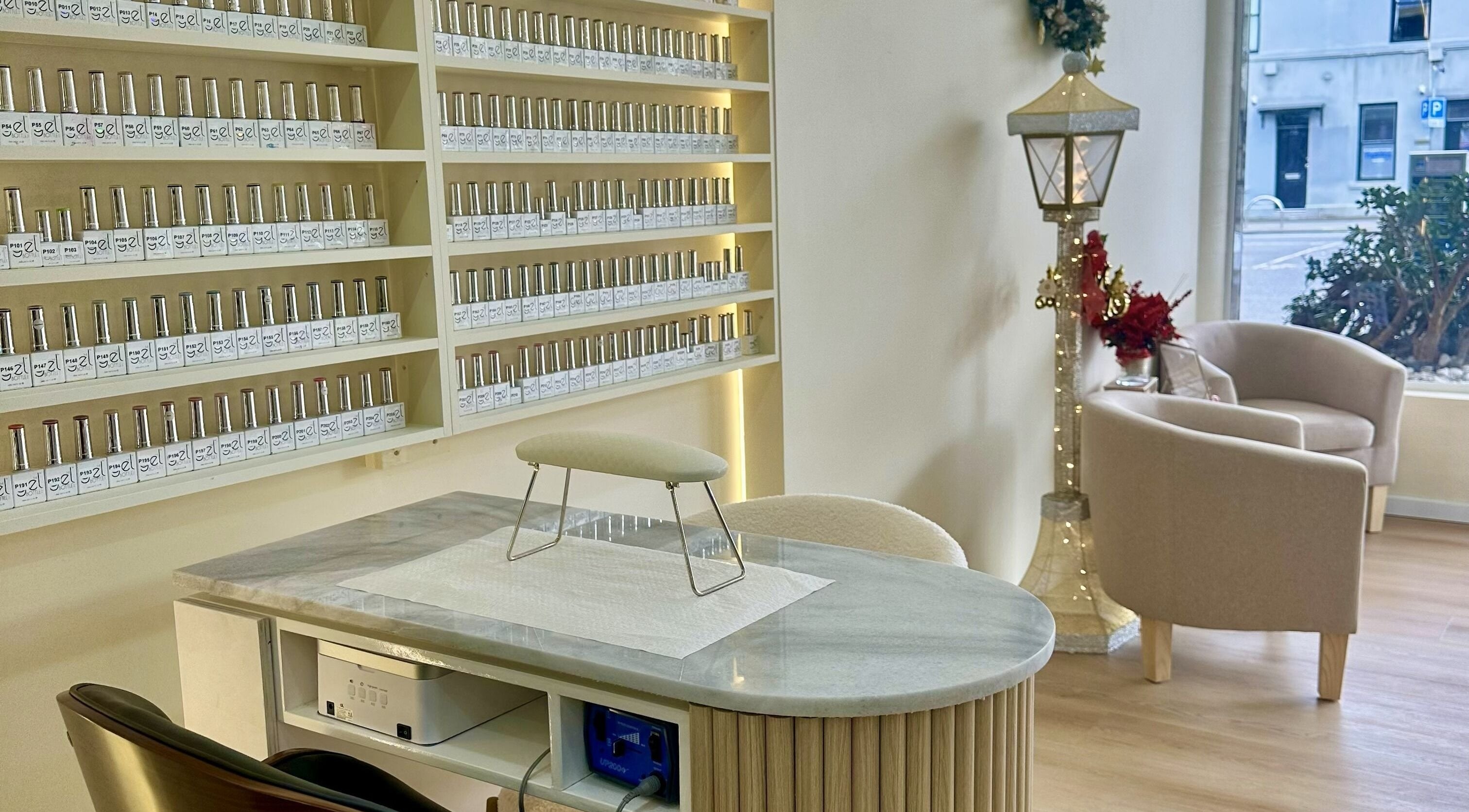 Chic interior of Posh Nails Boutique in Melbourne, Victoria, AU, featuring elegant nail polish display.