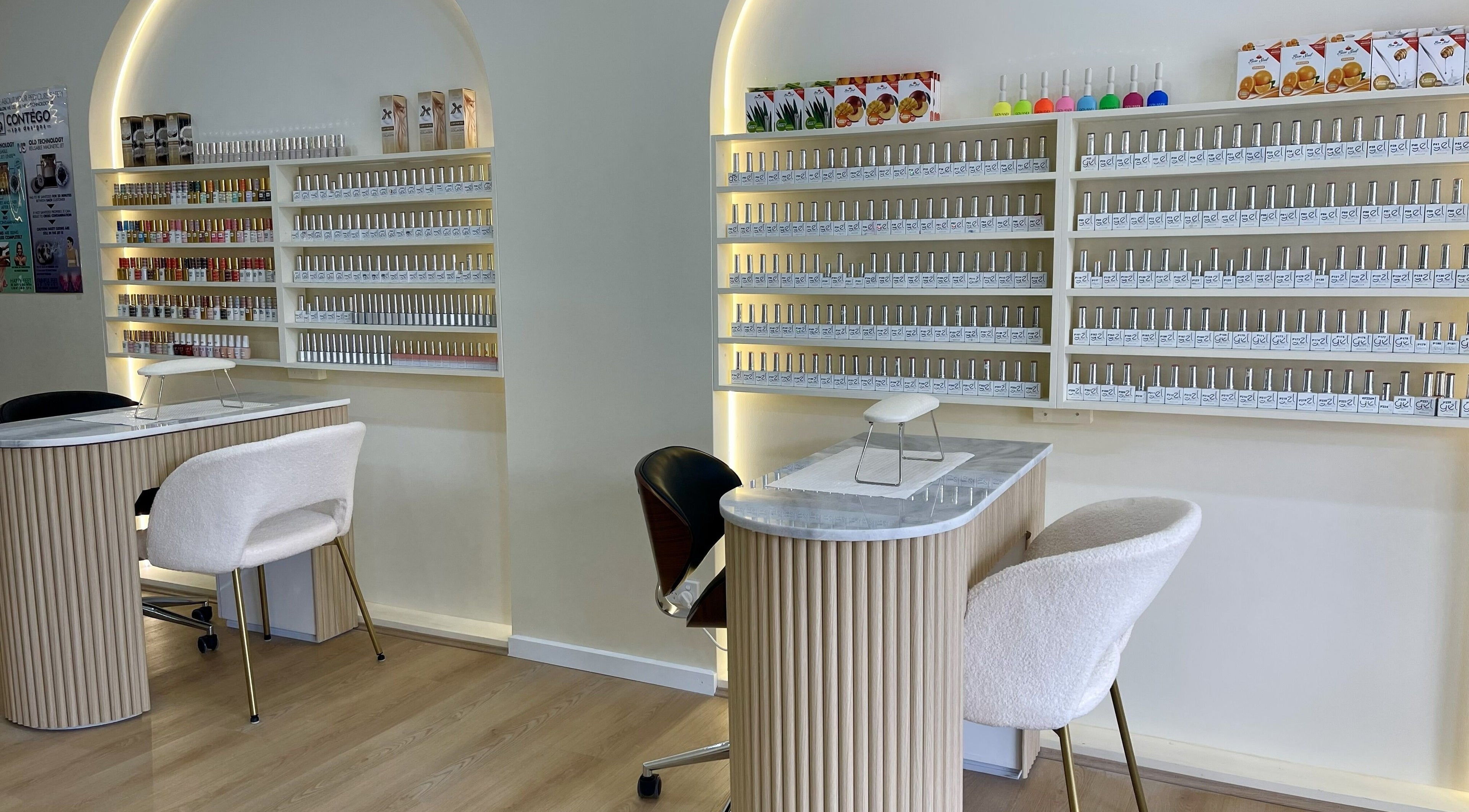 Polished interior of Posh Nails Boutique in Melbourne, Victoria, AU with stylish seating and nail polish display.