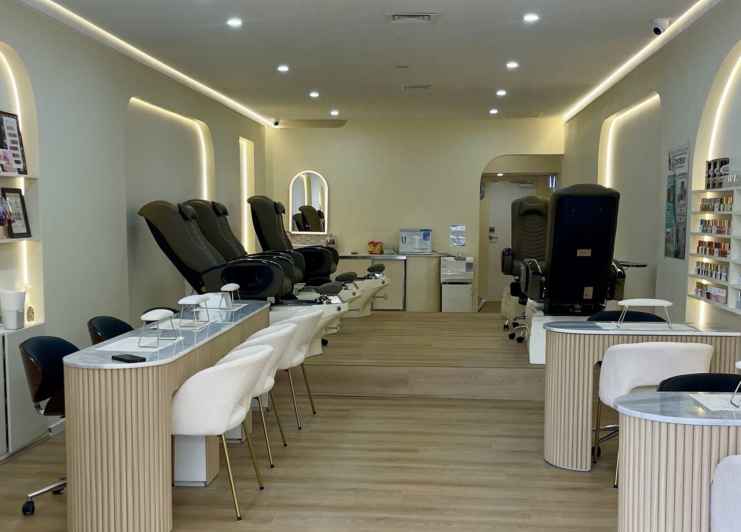 Elegant interior of Posh Nails Boutique in Melbourne, Victoria, AU, showcasing modern chairs and nail stations.