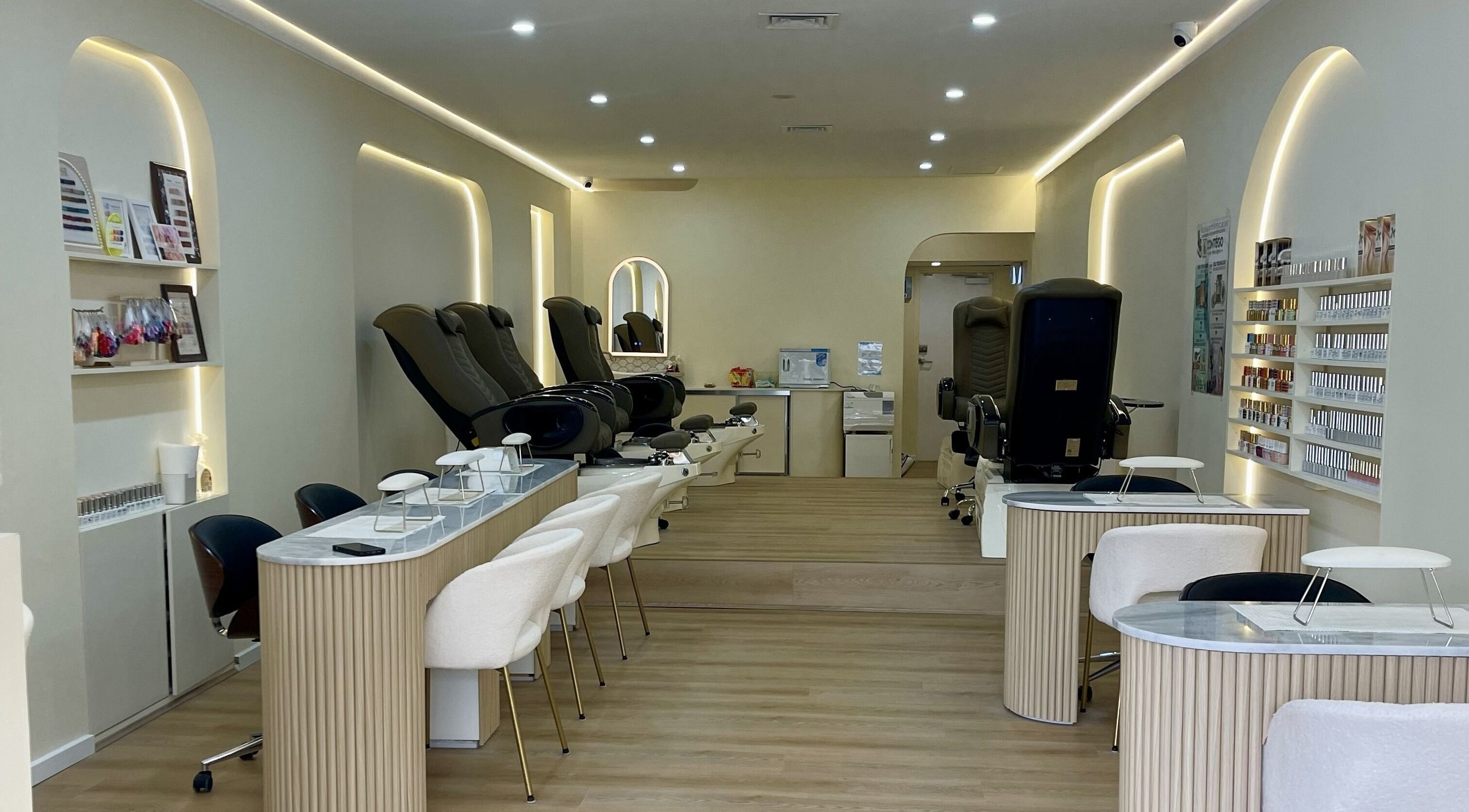 Elegant interior of Posh Nails Boutique in Melbourne, Victoria, AU, showcasing modern chairs and nail stations.