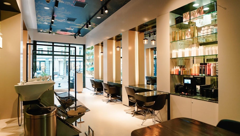 Modern salon interior at Hair salon De Pijp, Amsterdam, Noord-Holland, NL with elegant styling stations.