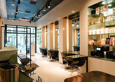 Modern salon interior at Hair salon De Pijp, Amsterdam, Noord-Holland, NL with elegant styling stations.