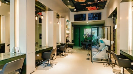 Modern interior of Hair Salon De Pijp in Amsterdam, Noord-Holland, NL, showcasing sleek styling stations.