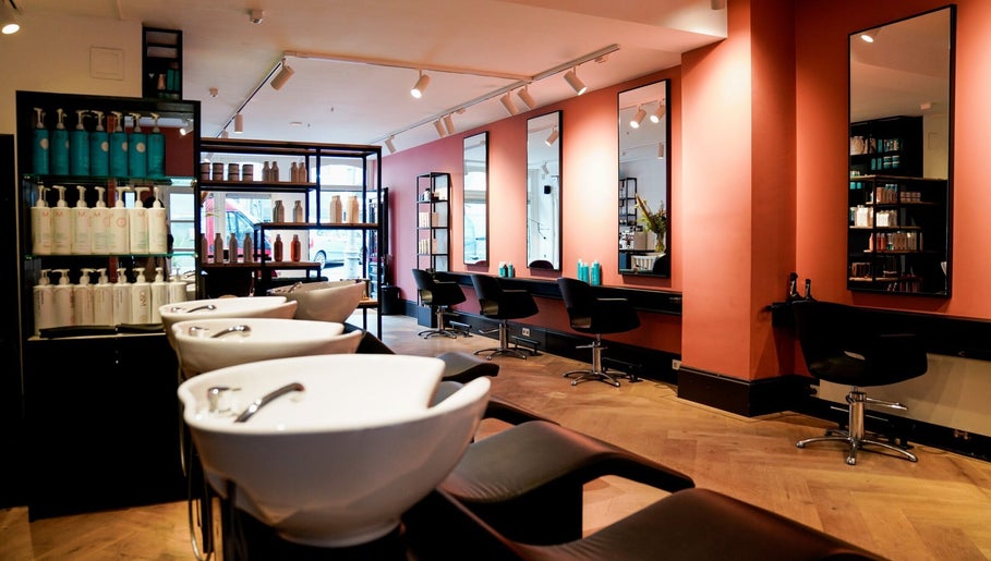 Sleek interior of Hair Salon Westerstraat, Amsterdam, Noord-Holland, NL with modern styling stations and mirrors.