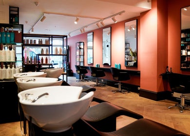 Sleek interior of Hair Salon Westerstraat, Amsterdam, Noord-Holland, NL with modern styling stations and mirrors.