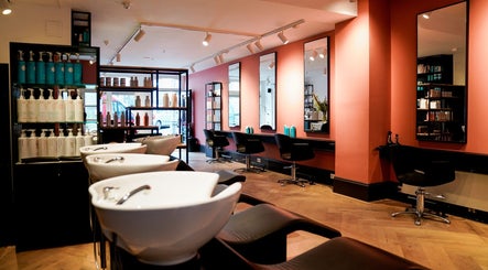 Sleek interior of Hair Salon Westerstraat, Amsterdam, Noord-Holland, NL with modern styling stations and mirrors.