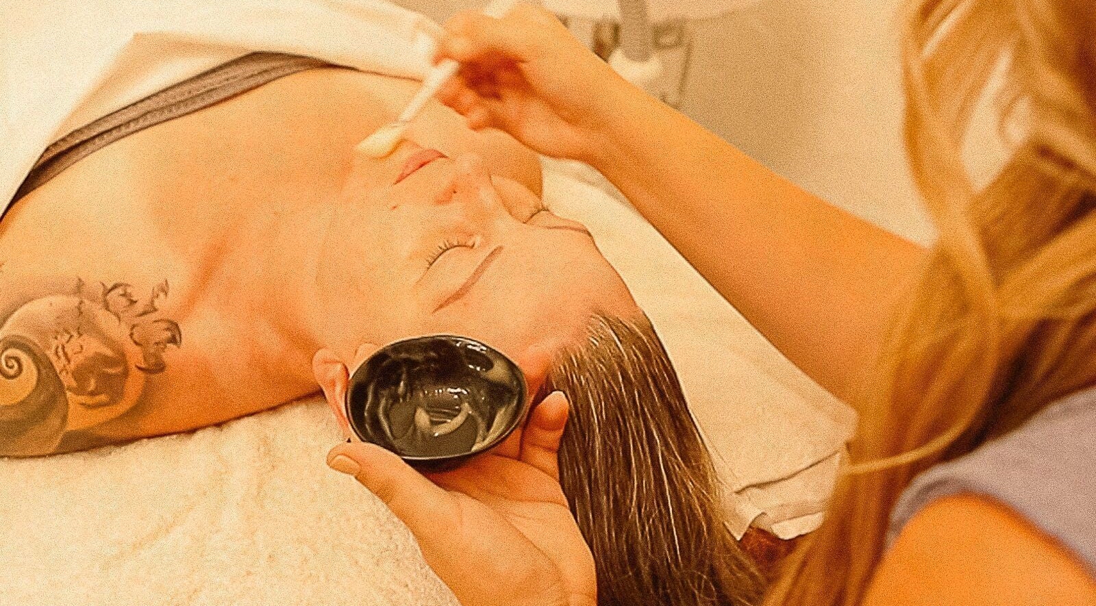 Person receiving facial treatment at Balanced Beauty by Leandra in Fort Pierce, Florida, US.