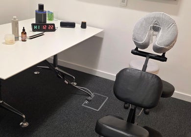 Massage setup at The Thera Pt, Blackburn, Scotland, GB featuring ergonomic chair and wellness products.