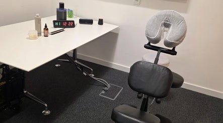 Massage setup at The Thera Pt, Blackburn, Scotland, GB featuring ergonomic chair and wellness products.