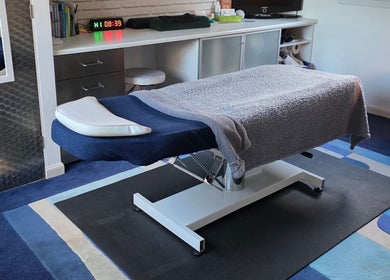 Relaxing therapy room at The Thera Pt, Blackburn, Scotland, GB, featuring a comfortable treatment table.