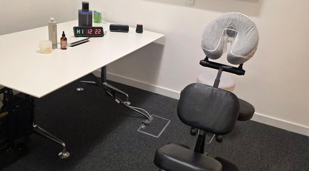 Massage chair and table setup at The Thera Pt, Blackburn, Scotland, GB for a relaxing wellness experience.