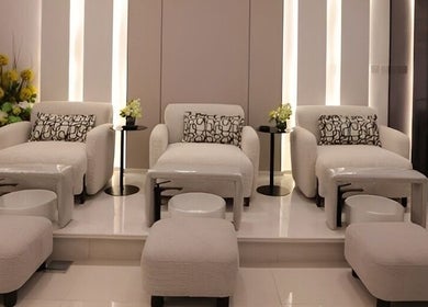 Luxurious seating area in Art Glam, Riyadh, Riyadh Province, SA with plush chairs and subtle lighting.