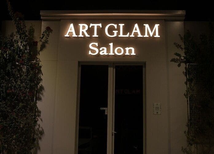 Illuminated Art Glam salon entrance at night in Riyadh, Riyadh Province, SA.