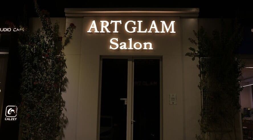 Illuminated Art Glam salon entrance at night in Riyadh, Riyadh Province, SA.