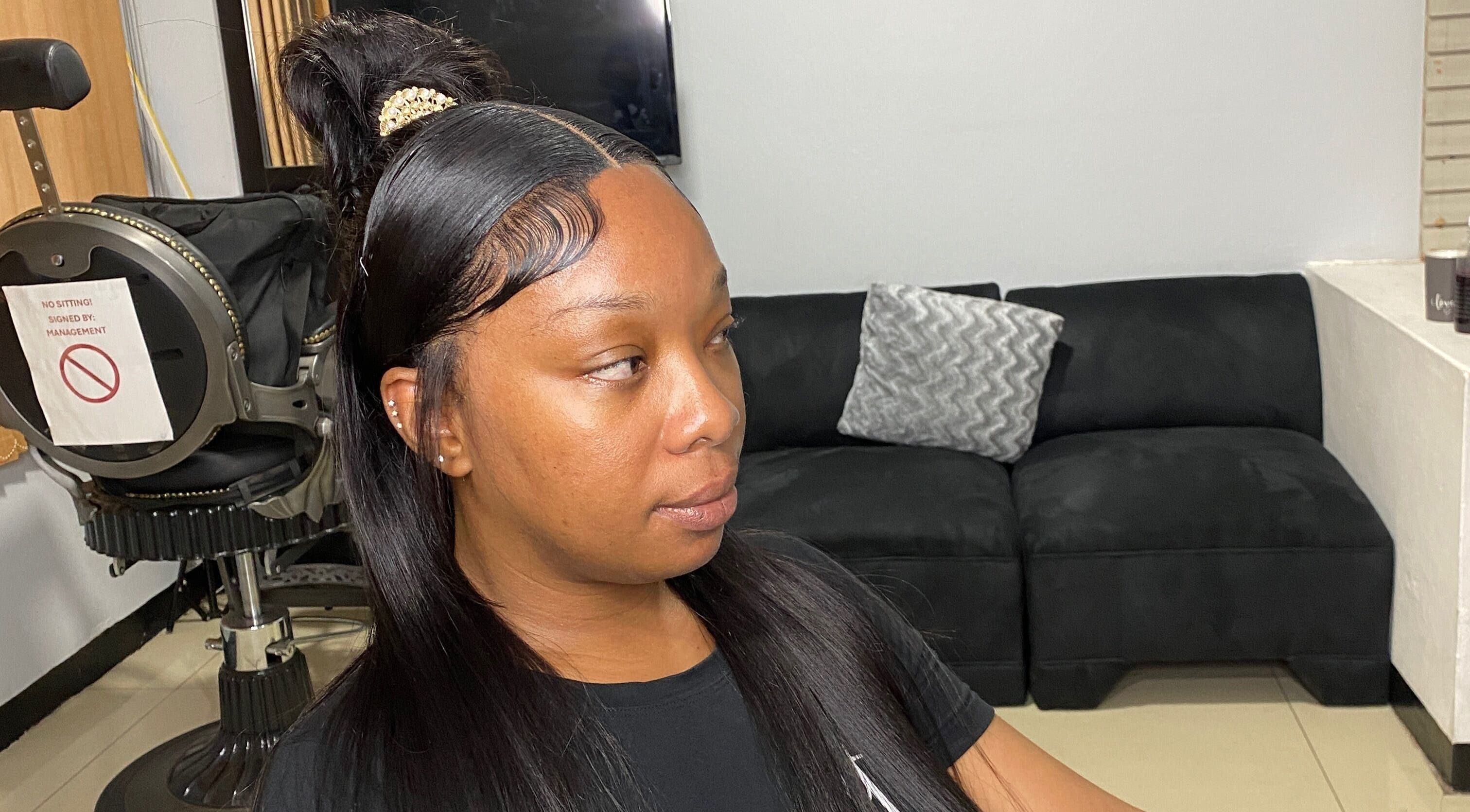 Client with sleek hairstyle at HAIRBYDAE98 in Kingston, JM, showcasing expert salon care.