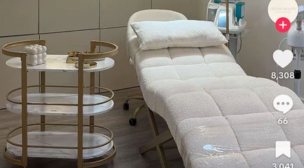 Elegant treatment room at Cosmic Glow Room, Copthorne, England, GB featuring a plush treatment bed.