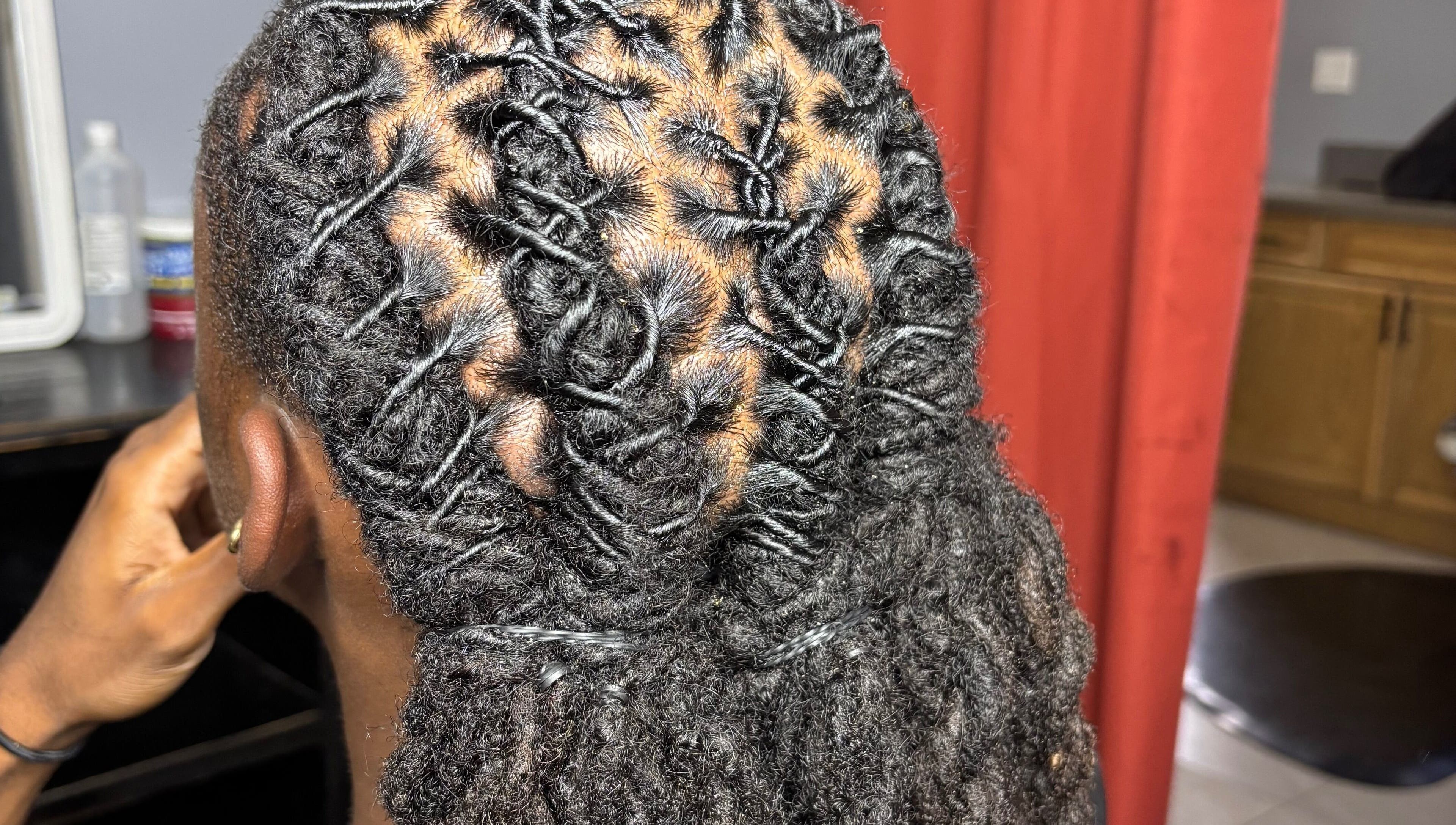 Close-up of intricately styled locs at Loc’d n Kee, The Quarter, AI.