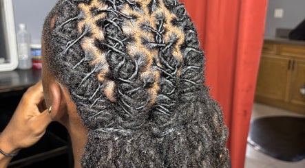 Close-up of intricately styled locs at Loc’d n Kee, The Quarter, AI.