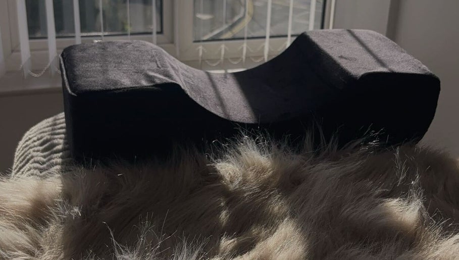 Sunlit cozy pillow at The Extension Bar, Onchan, Isle of Man, GB, offering relaxation and comfort.