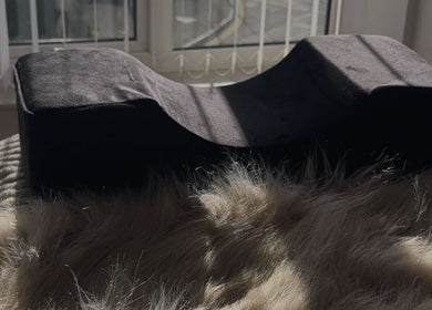 Sunlit cozy pillow at The Extension Bar, Onchan, Isle of Man, GB, offering relaxation and comfort.