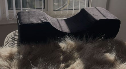 Sunlit cozy pillow at The Extension Bar, Onchan, Isle of Man, GB, offering relaxation and comfort.