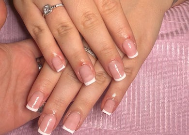 Sophisticated French manicure at Popsiesmanis, Southampton, England, GB. Classic nail design on a pink mat.