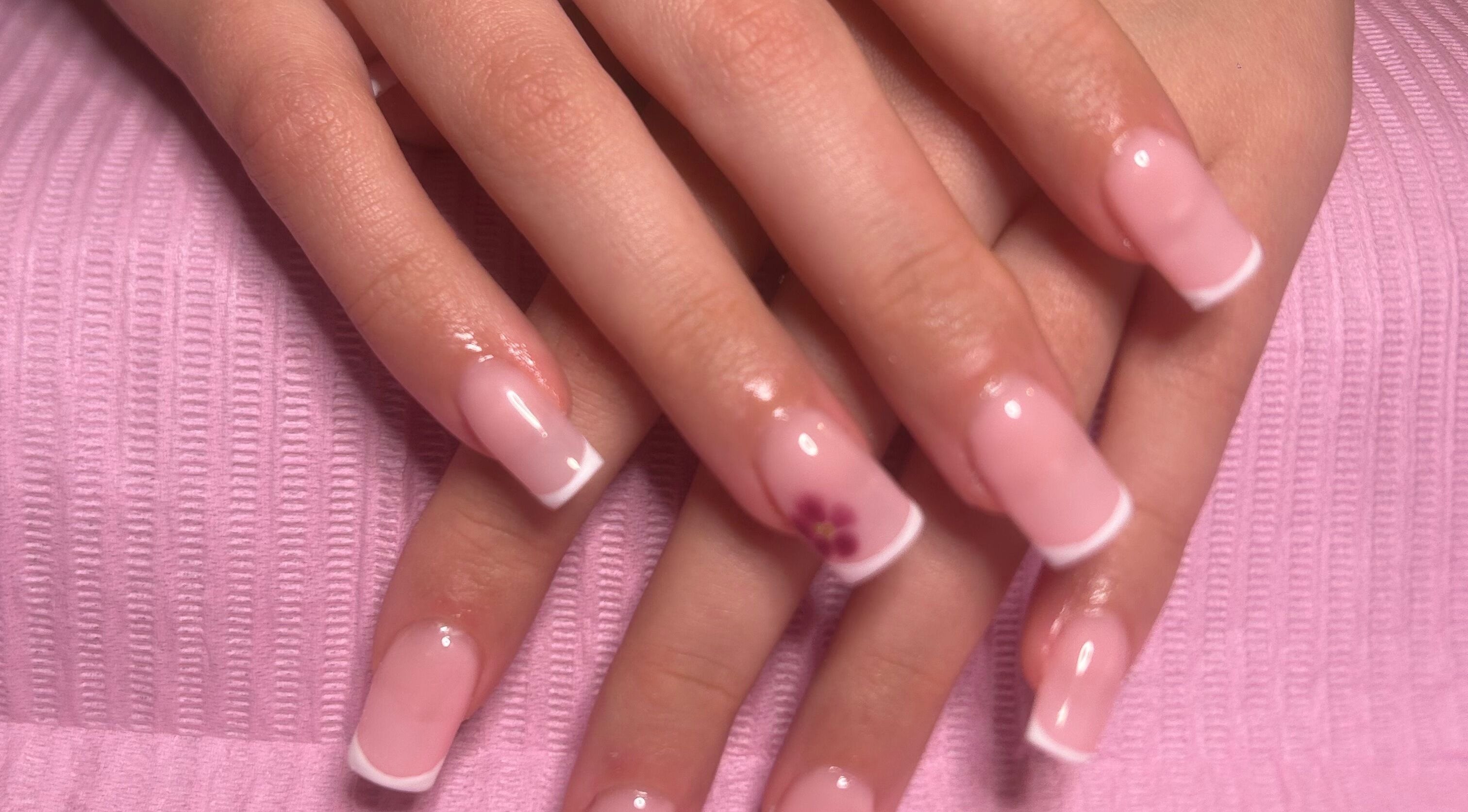 French manicure with floral accent at Popsiesmanis, Southampton, England, GB.