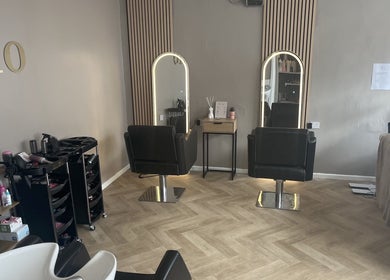 Chic interior of Leah Davies Hairdressing @ C.Lo Hair & Beauty, Hartlebury, England, GB with modern salon chairs.