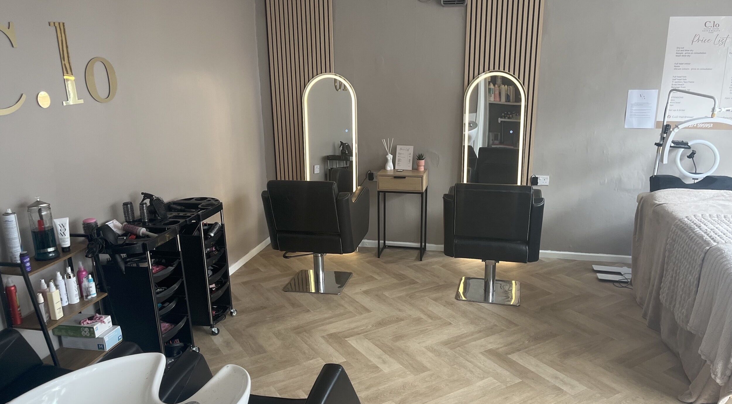 Chic interior of Leah Davies Hairdressing @ C.Lo Hair & Beauty, Hartlebury, England, GB with modern salon chairs.
