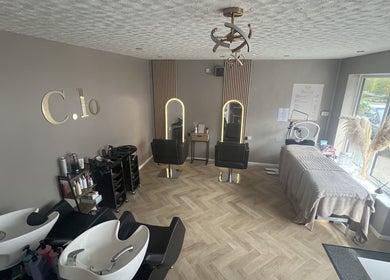 Interior of Leah Davies Hairdressing at C.Lo Hair & Beauty in Hartlebury, England, GB, featuring styled chairs.