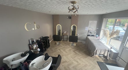 Interior of Leah Davies Hairdressing at C.Lo Hair & Beauty in Hartlebury, England, GB, featuring styled chairs.