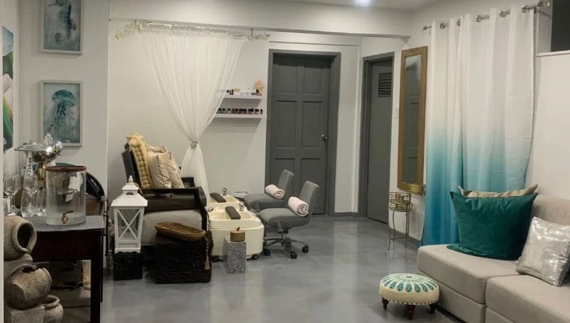 Cozy nail salon interior at LashMeBaby, Holetown, Saint James, BB with plush seating and calming decor.