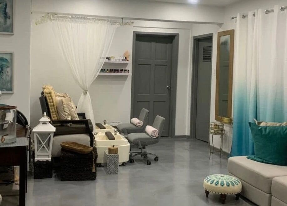 Cozy nail salon interior at LashMeBaby, Holetown, Saint James, BB with plush seating and calming decor.