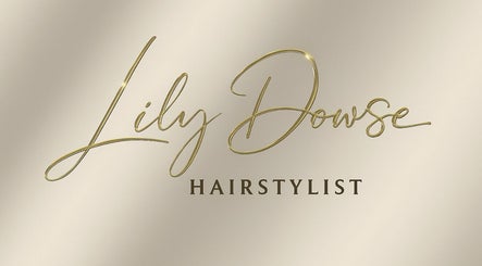Hairbylilydowsexx logo in gold script on beige at Bondi Beach, New South Wales, AU.